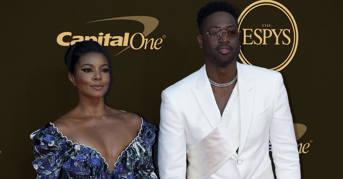 NBA former player Dwyane Wade with wife Gabrielle Union speak with