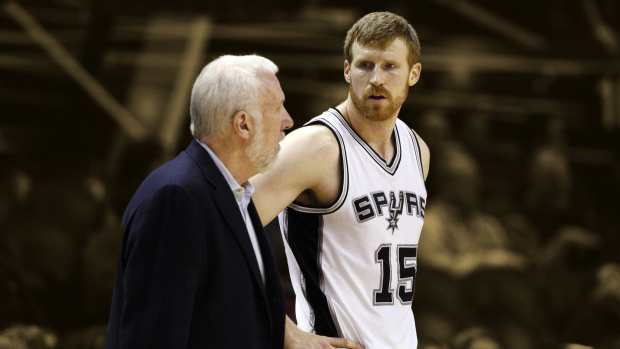 San Antonio Spurs head coach Gregg Popovich talks to power forward Matt Bonner (15) 