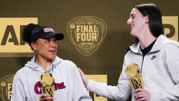 South Carolina Gamecocks coach Dawn Staley (left) and Iowa Hawkeyes guard Caitlin Clark pose react after being selected as the AP Coach and Player of the Year at a press conference at Rocket Mortgage FieldHouse.