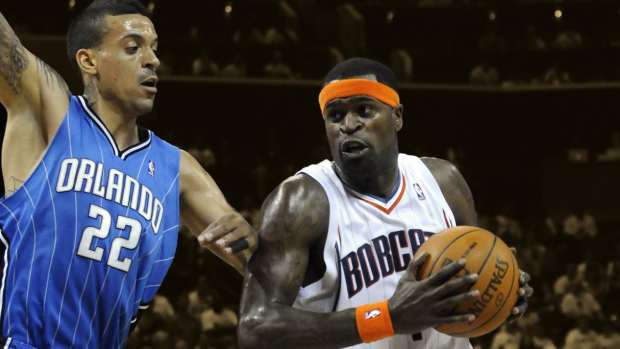 Charlotte Bobcats guard forward Stephen Jackson (1) is defended by Orlando Magic forward Matt Barnes (22)