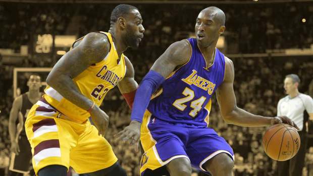 Cleveland Cavaliers forward LeBron James defends Los Angeles Lakers forward Kobe Bryant