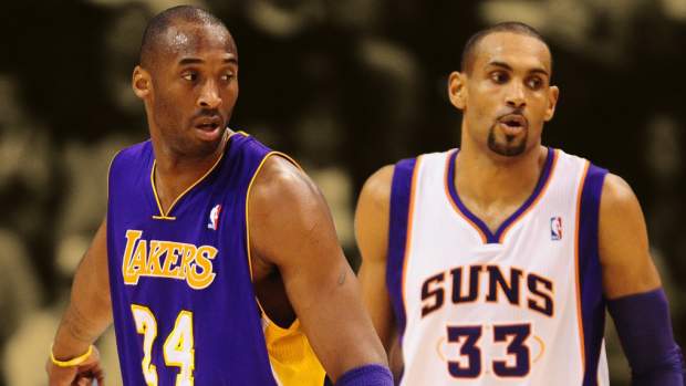 Los Angeles Lakers guard (24) Kobe Bryant stands alongside Phoenix Suns forward (33) Grant Hill