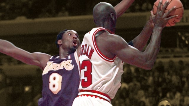 Los Angeles Lakers guard Kobe Bryant contests Chicago Bulls legend Michael Jordan's shot