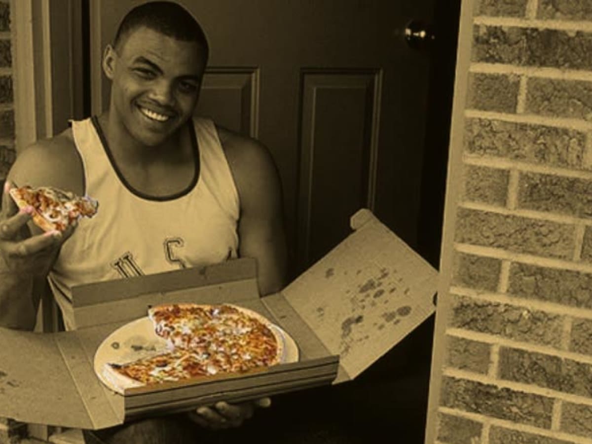Casual portrait of Auburn Charles Barkley at home eating pizza