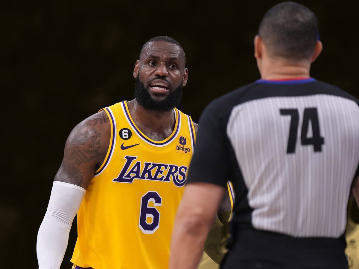 Dennis Rodman of the Los Angeles Lakers listens to a referee during